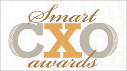 The Smart CXO Awards logo, featuring gray and orange fonts on a white background with tire textures.
