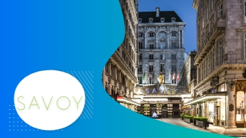 Savoy Hotel London, an architectural marvel, features flags, lush landscaping, and a vibrant ambiance.