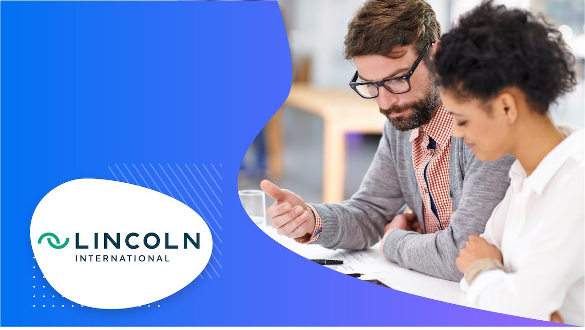 A man and woman discussing business, with the Lincoln International logo in the corner.