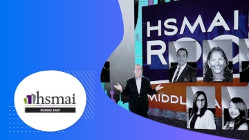 The HSM AI ROADMAP graphic with people and a man on stage.