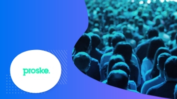 A crowd of people gathered at a Proske event, with the company logo displayed prominently on a blue background.