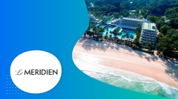 Le Meridien resort with a swimming pool, beach, and lush greenery, surrounded by trees and the ocean.