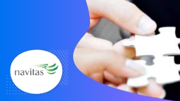 A hand holding a puzzle piece with Navitas logo on a blue background.