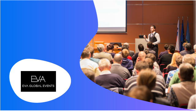 A man stands in front of a group of people in a conference room at EVA Global Events.