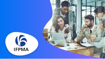A group of business people in formal attire in a meeting with an IFPMA logo.