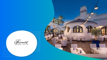 Fairmont Scottsdale resort features an elegant architecture, lush landscaping, and an inviting ambiance with a dining area.