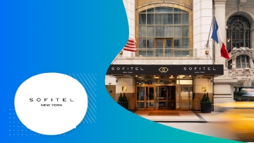Sofitel New York hotel entrance showcasing architecture, landscaping, and vibrant ambiance.
