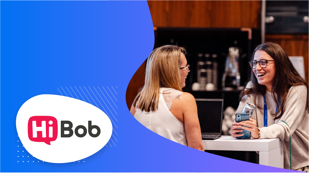 Two women standing together, one wearing a badge, and a Hi Bob logo in the foreground.