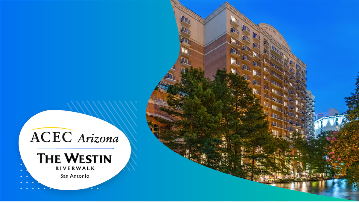 Hotel surrounded by trees next to the San Antonio River