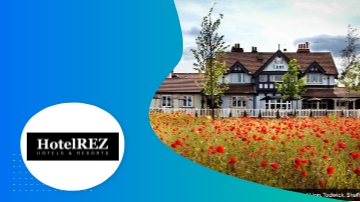 HotelREZ logo with picture of hotel and field of flowers