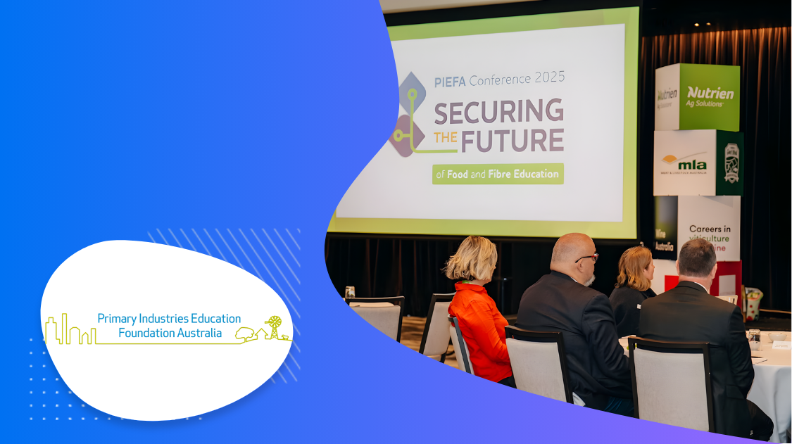 Several people sitting in an event with PIEFA logo in the front.