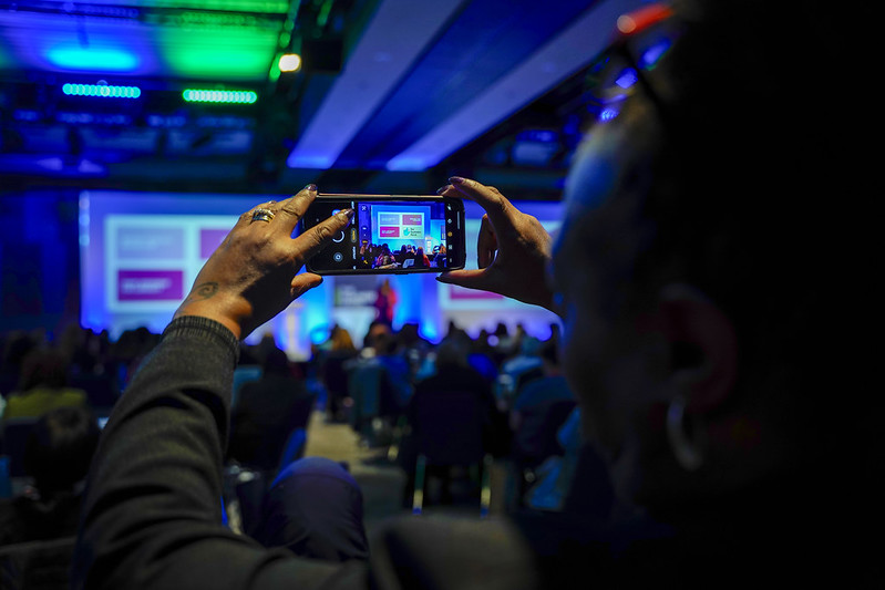 NASUWT event, person clicking photo of the event