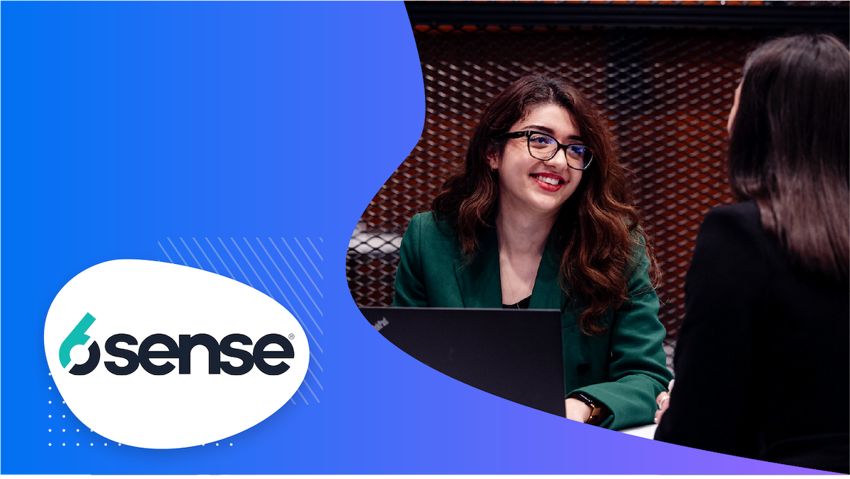 Two women talking at a trade show 