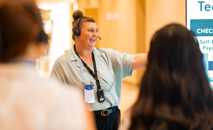 Person in a hospitality setting featured in a promotional image.