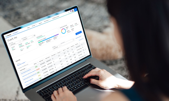 Woman using a laptop with the Cvent dashboard on the screen