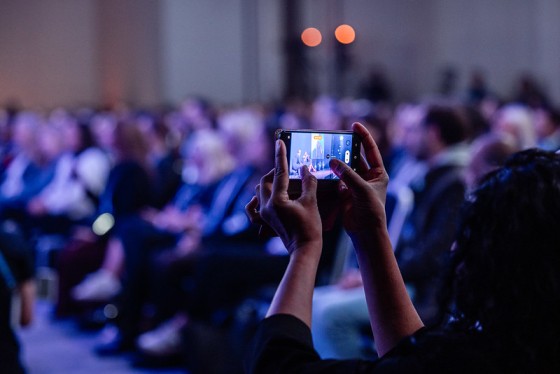 Woman taking picture at Cvent CONNECT Europe