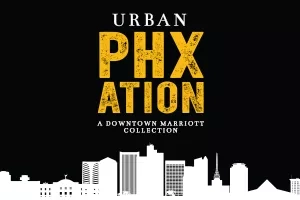 PHXation logo with urban city skyline on a black background.