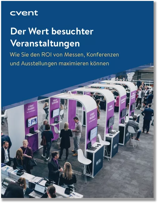 Several people are standing and sitting around the Cvent station at the event, with a blue and white background.