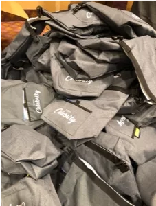 Bags with the word "Celebrity" written on them are piled on top of each other.
