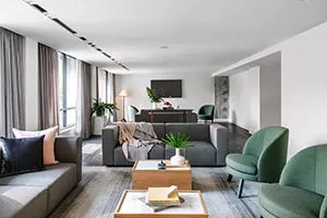 Studio apartment at Line Austin by Hilton with a couch, chairs, and coffee tables in the living room.