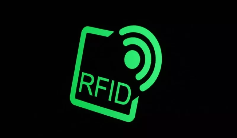 A glowing green square icon with the text "RFID" on a black background.