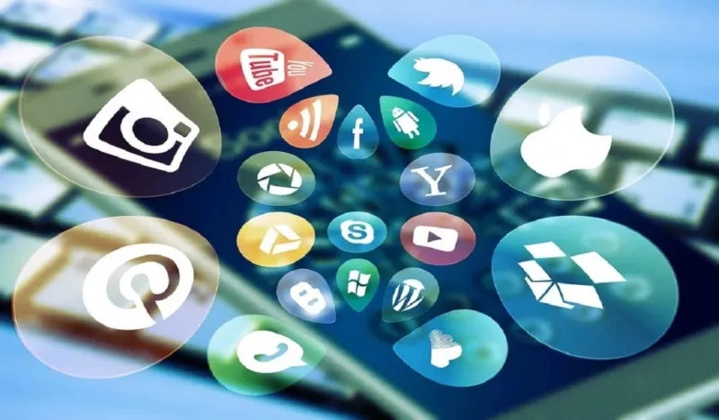 A keyboard with various social media icons displayed on it, including Facebook, Instagram, and Pinterest.