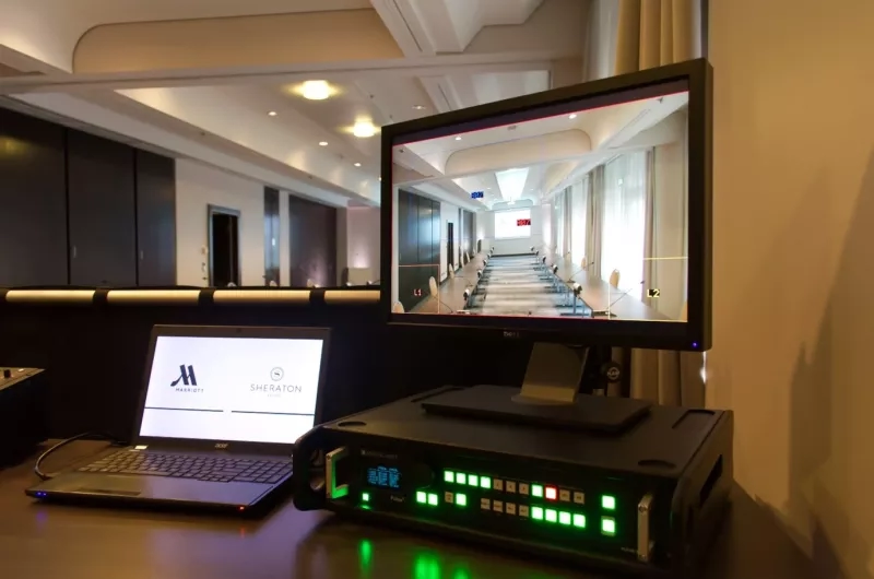 Laptop and monitor showing a room at the Sheraton in Frankfurt, Germany.