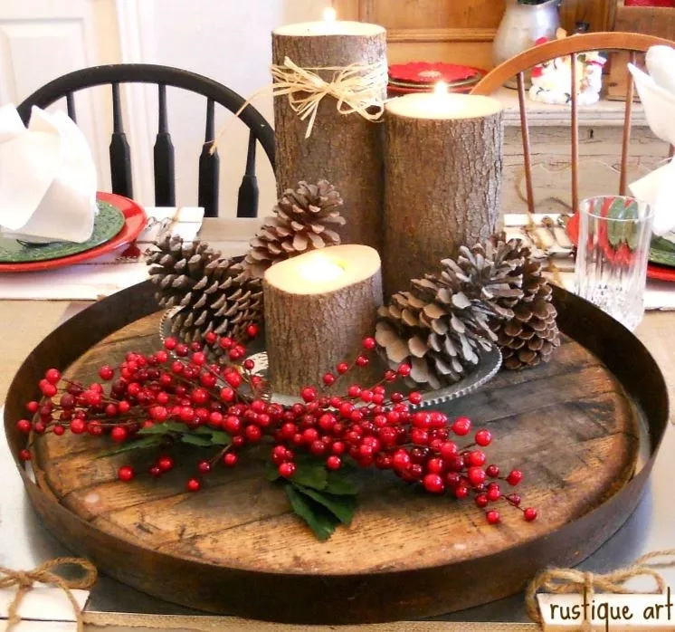 Rustic Christmas decor with pine cones, berries, and candles on a wooden tray in a cozy dining area.