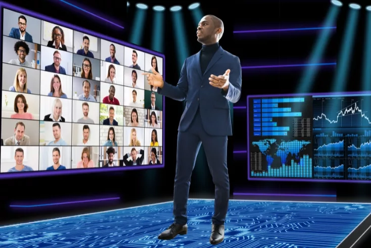 Man in a suit giving a presentation to a virtual audience.