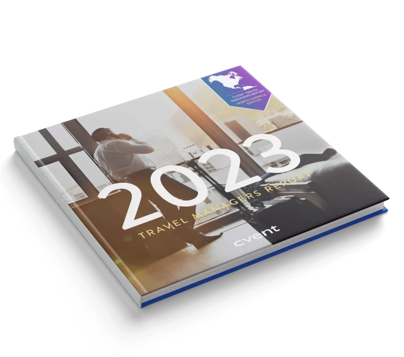 Travel manager report 2023 with a picture of a man talking on the phone in his office.