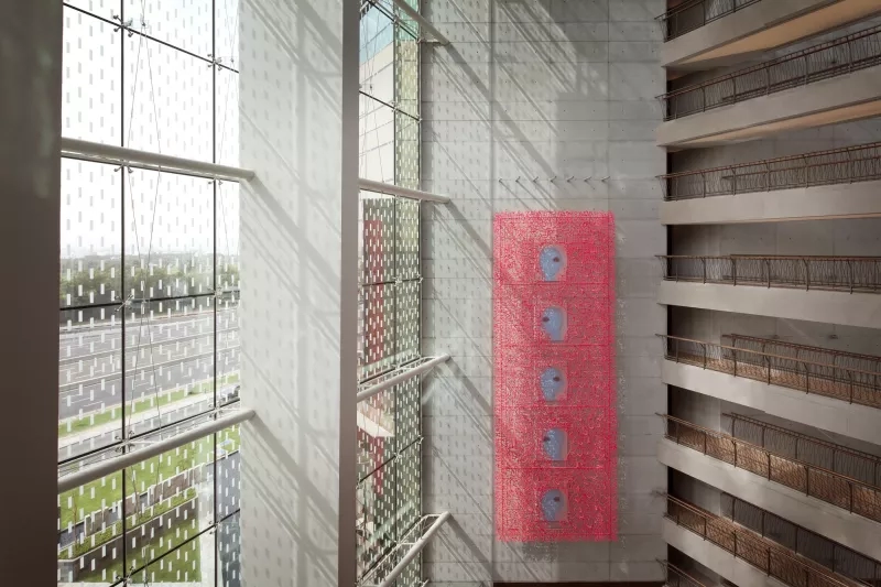 Jumeirah Creekside Hotel - Halim Al Karim_ Flying Carpet, 2011, showcasing a red object, architecture, and landscaping.