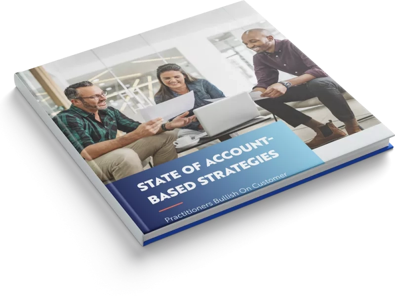 State of account-based strategies book with people on a couch in a modern office.