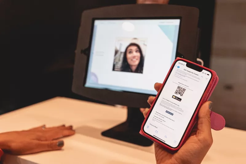 A person scanning a QR code to check in to an event with the mobile app.