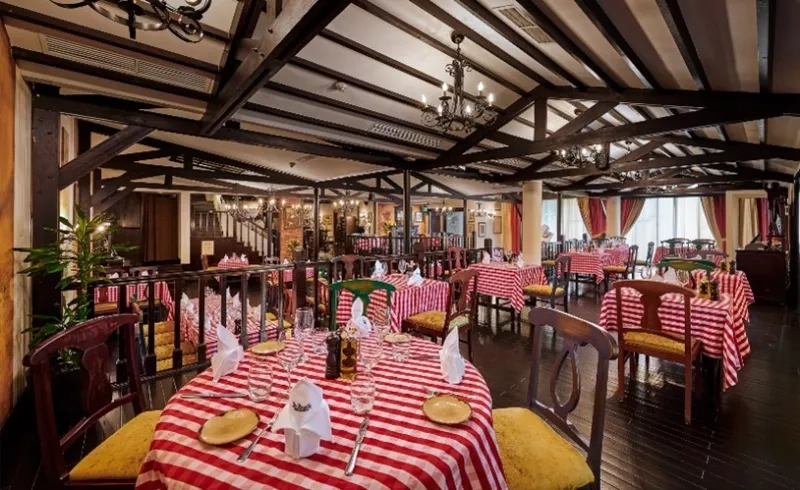 Indoor dining area with table and chairs at Le Jardin restaurant in Manila.