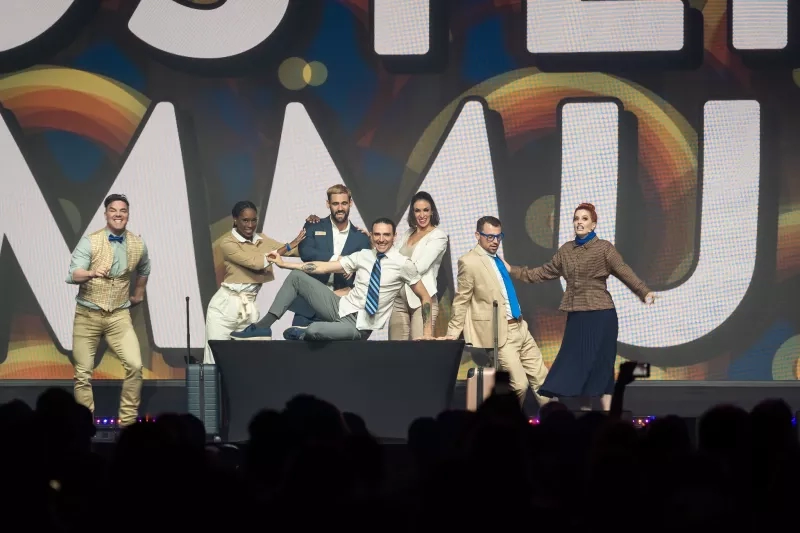 Six people stand on stage in front of a large screen at Cvent CONNECT 2023.