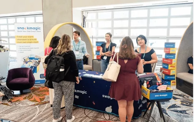 A group of people gathered at the snack magic event at the pop-up event.