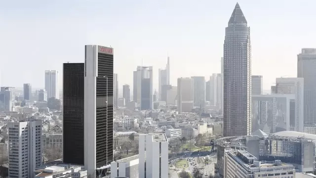 Frankfurt Marriott Hotel, a modern architectural marvel, stands tall amidst a cityscape of towering skyscrapers.