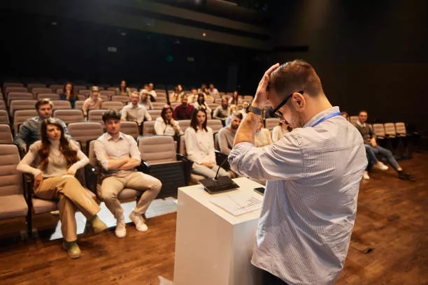 a stressed man anchoring at an event