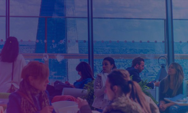 Group competitive set dashboards hero banner of people in a restaurant with a view of the Shard.