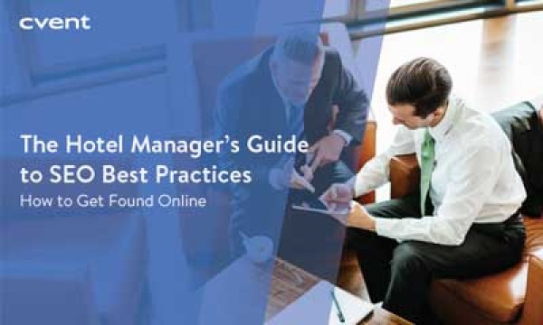 Two men at hotel discussing SEO best practices for hotels.