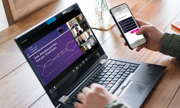 Person using laptop and mobile app to track attendance and data from virtual events.