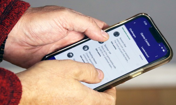 A person using the mobile app on their phone.