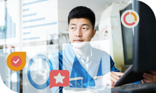 Asian man working on a computer with Google logos in the foreground and a graph in the background.