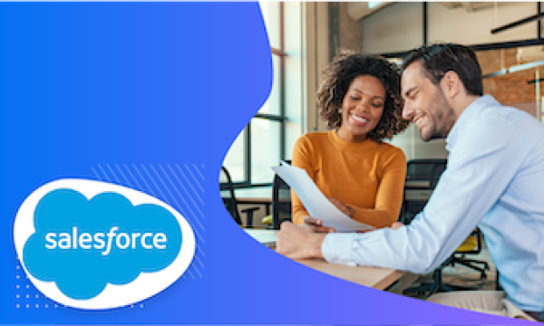 Two people with paper, smiling, in front of Salesforce logo on blue background.