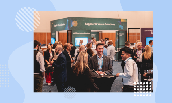A group of people in a business suit are having a meeting in a conference room.
