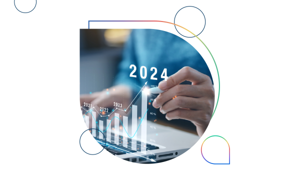 Person working on laptop with a graph showing revenue growing to 100% in 2024