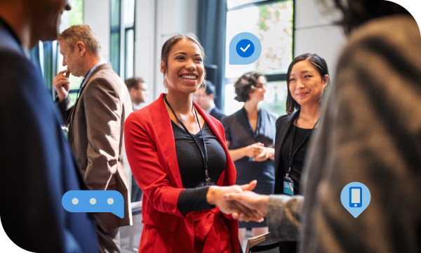 A group of people are gathered together in a room for a business meeting.