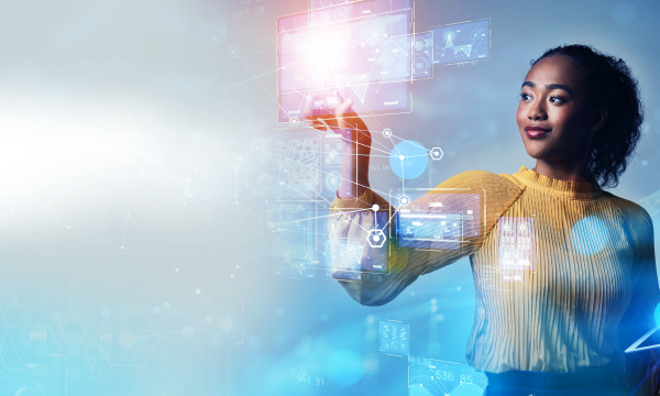 A woman is holding a virtual screen with a blue background and various icons displayed on it.