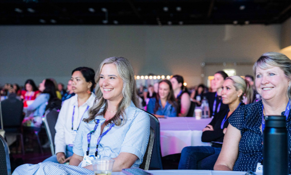 Group of women smiling and laughing during a Better Together event.