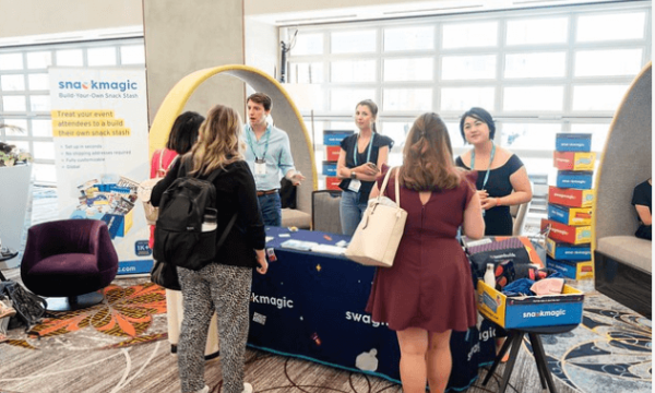 A group of people gathered at the snack magic event at the pop-up event.